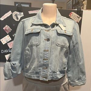 Classic Light Blue Denim Jacket with iron on design on the back. L is 17”.